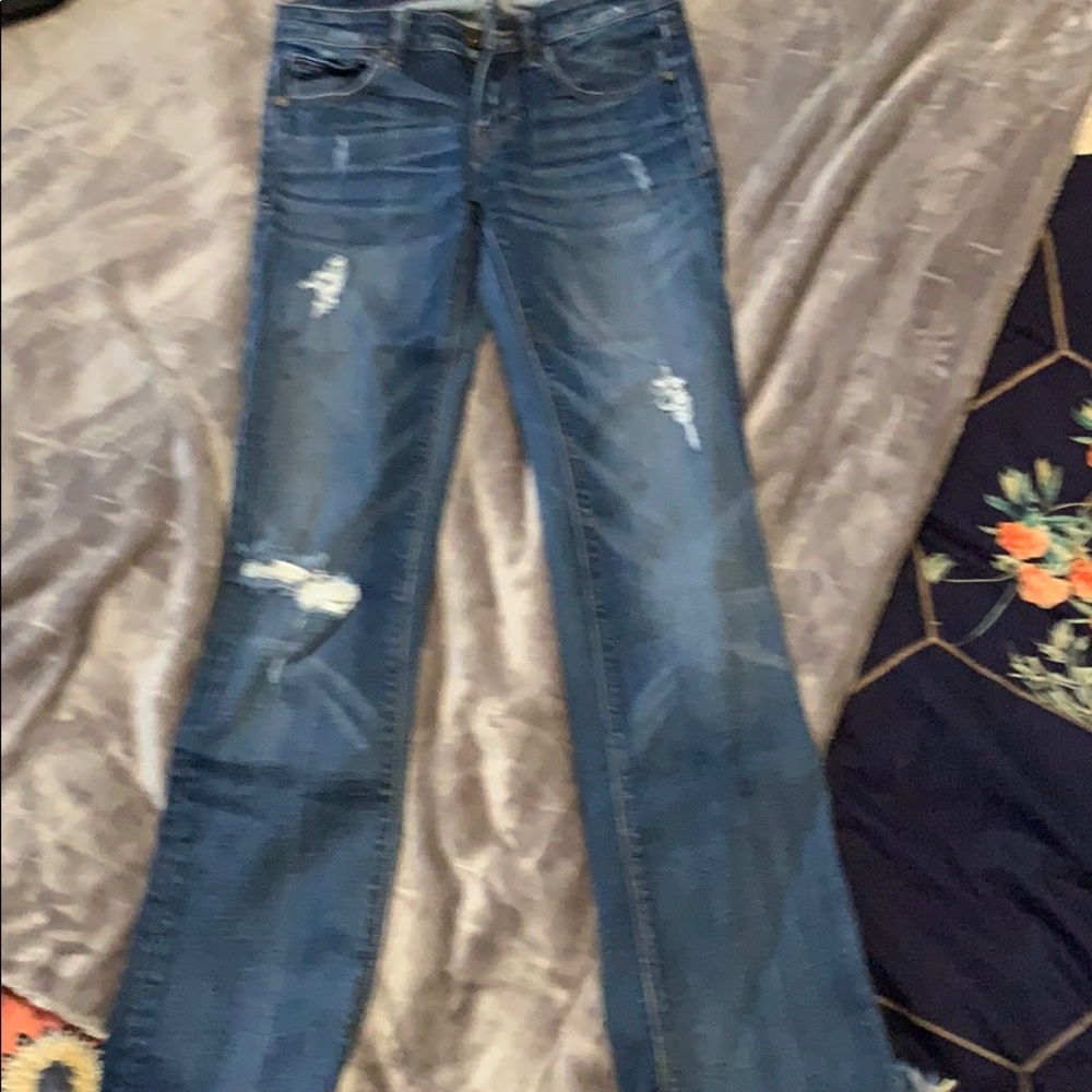 Distressed denim jeans